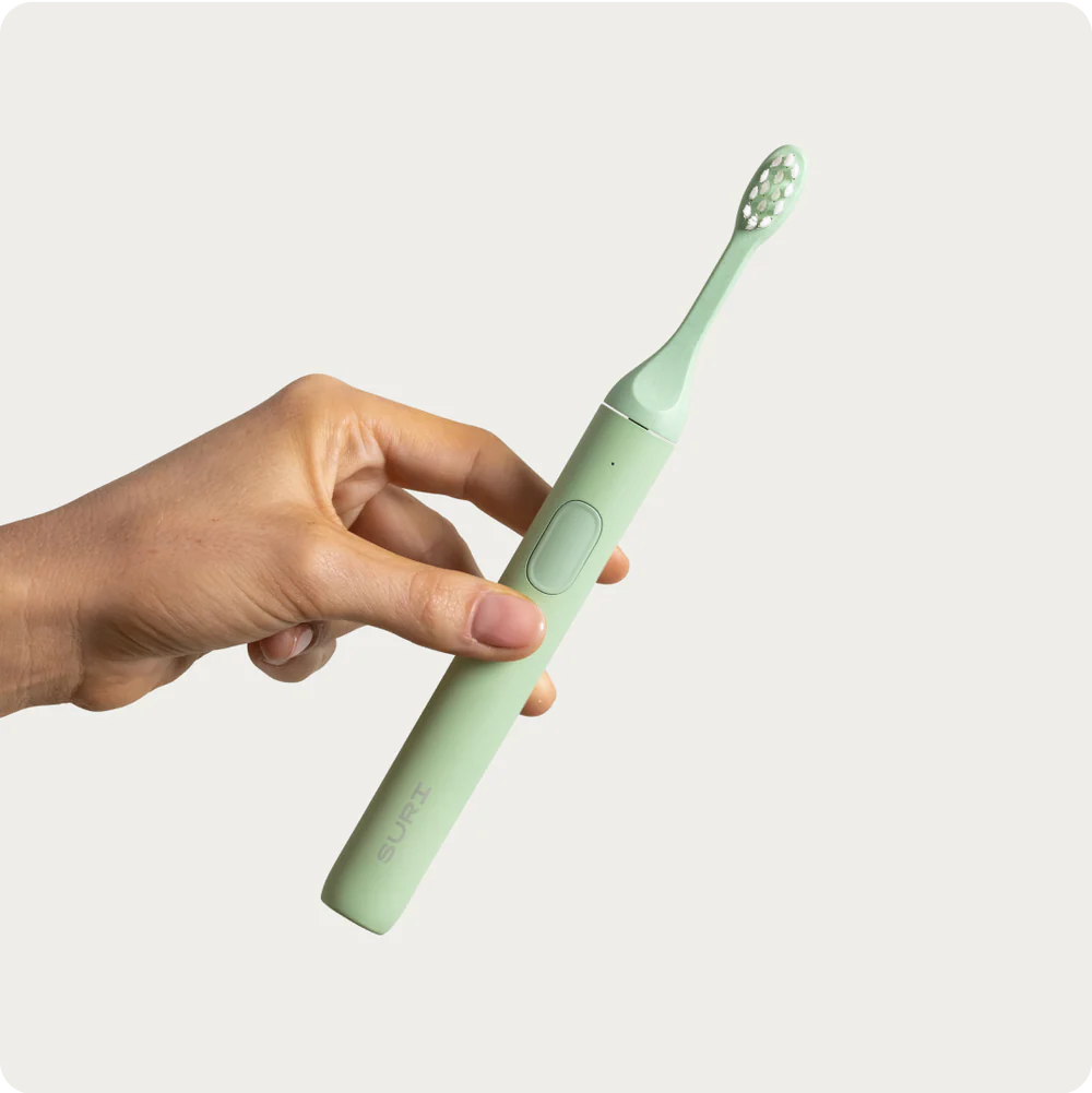 Suri electric toothbrush with travel case